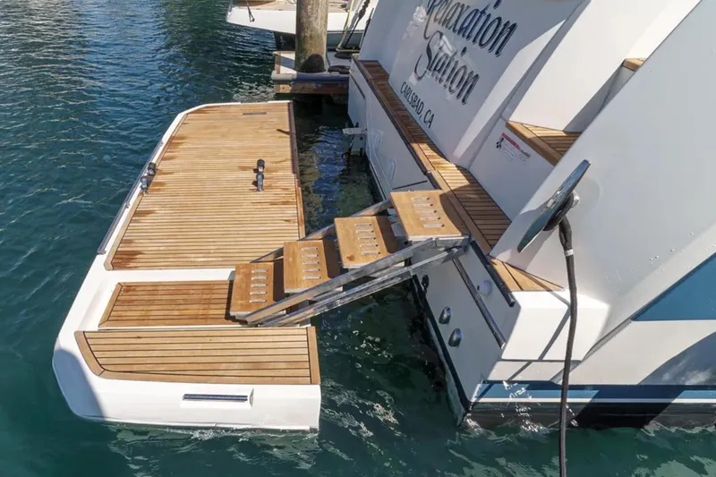 Slide: The Image of Luxury yacht Prestige 520, 2019 model, with wooden swim platform and retractable steps. - 35