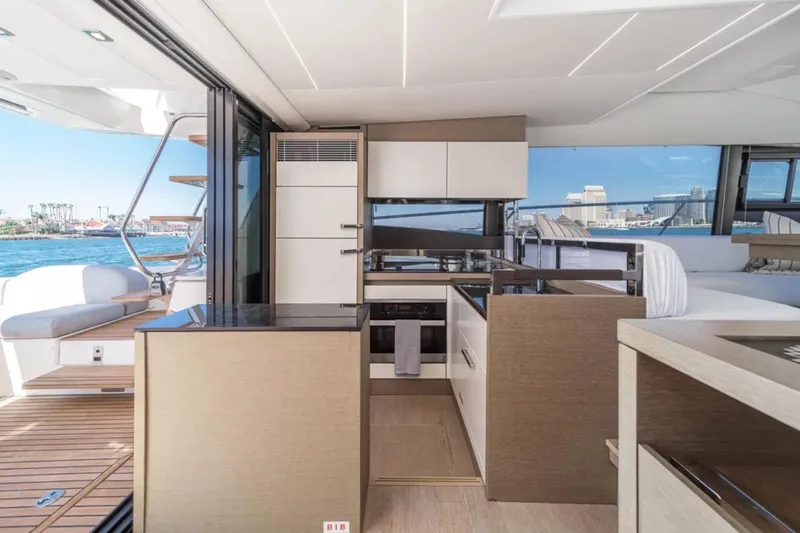 Slide: The Image of Modern interior of 2019 Prestige 520 yacht with sleek kitchen and ocean view. - 8