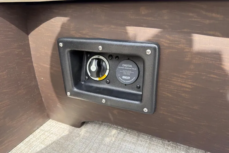 Slide: The Image of 2025 Tahoe 2585 digital voltage sensitive relay switch on wooden panel. - 13