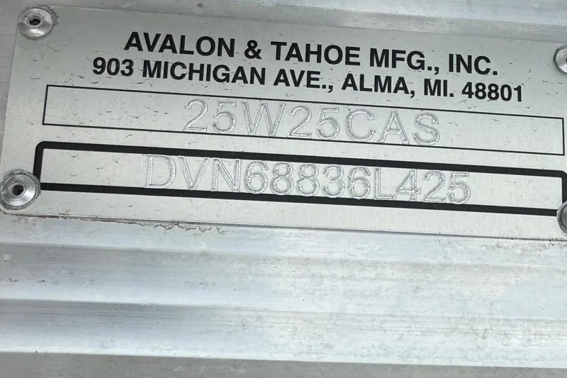 Slide: The Image of Metal plate with Avalon & Tahoe manufacturing details and serial numbers. - 6