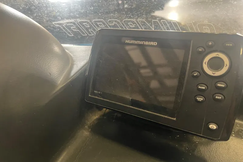 Slide: The Image of Humminbird Helix 5 fish finder on 2017 Alumacraft 165 boat dashboard. - 2