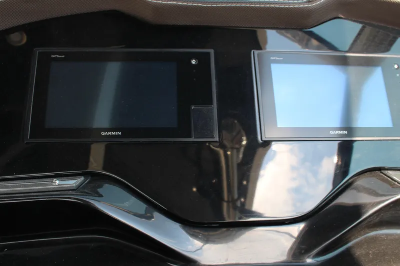 Slide: The Image of Garmin GPS displays on 2017 Cobalt R35 dashboard, reflecting sunlight. - 17