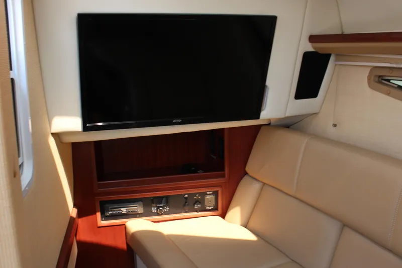 Slide: The Image of 2017 Cobalt R35 interior with TV, beige seating, and wooden accents. - 20