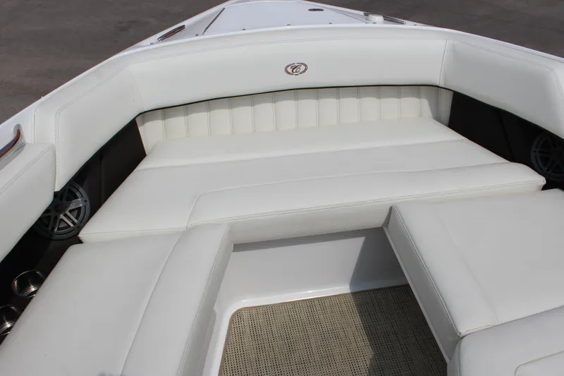 Slide: The Image of 2017 Cobalt R35 boat interior with white cushioned seating and speaker system. - 22