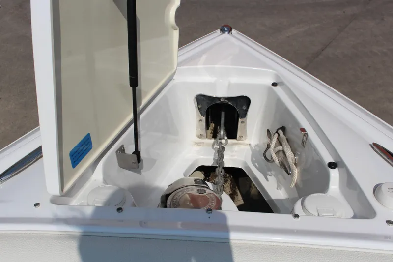 Slide: The Image of Open anchor compartment on 2017 Cobalt R35 boat, showing chain and rope storage. - 27