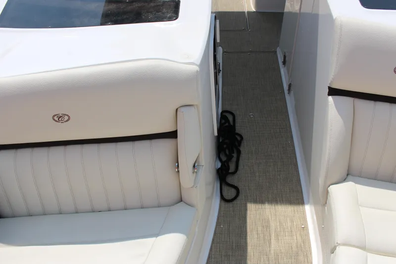 Slide: The Image of Interior of a 2017 Cobalt R35 boat with white leather seating and carpeted floor. - 29