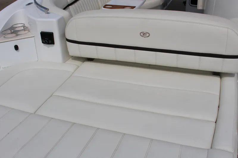 Slide: The Image of Luxurious white seating on 2017 Cobalt R35 Surf boat, featuring cup holders and sleek design. - 3