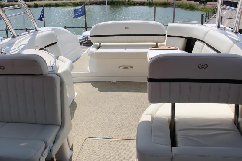 Slide: The Image of Luxurious interior of 2017 Cobalt R35 boat with white seating and lake view. - 30
