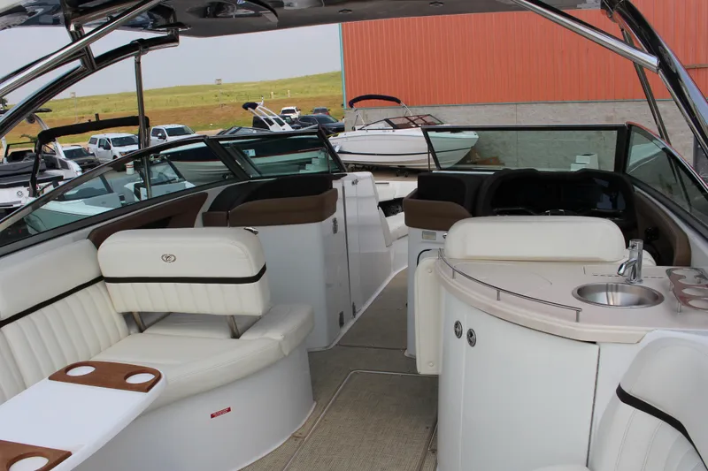 Slide: The Image of Luxurious interior of a 2017 Cobalt R35 boat with white seating and a compact sink. - 33