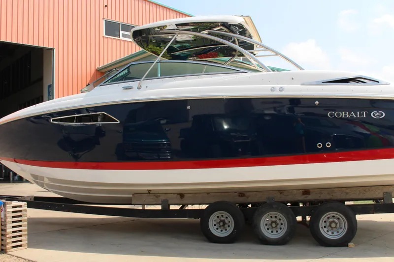 Slide: The Image of 2017 Cobalt R35 boat on trailer outside a building. - 43