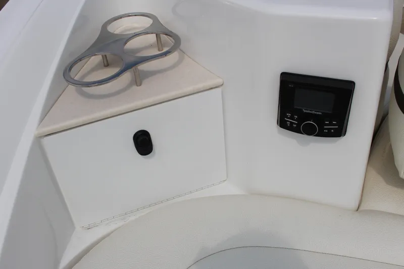 Slide: The Image of 2017 Cobalt R35 boat interior with cup holder and control panel. - 48