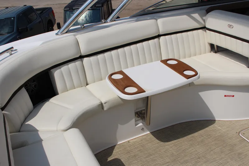 Slide: The Image of Luxurious seating area on a 2017 Cobalt R35 boat with a stylish table. - 50