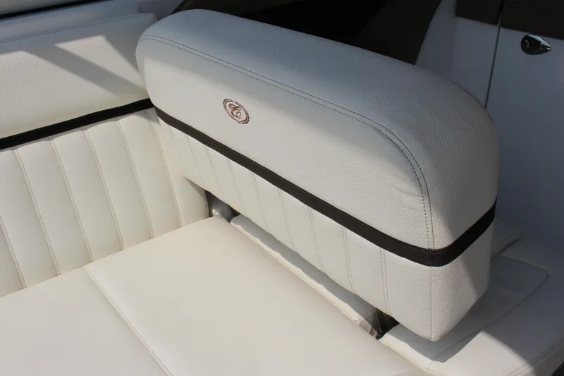 Slide: The Image of 2017 Cobalt R35 boat interior with white leather seating and logo detail. - 56