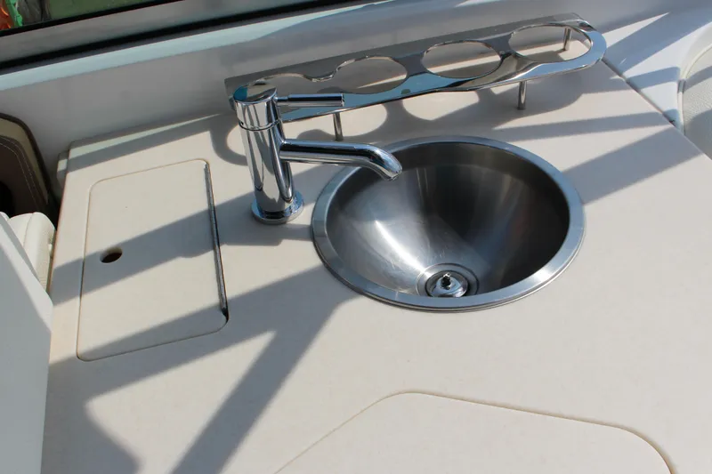 Slide: The Image of Stainless steel sink and faucet on 2017 Cobalt R35 boat countertop. - 58