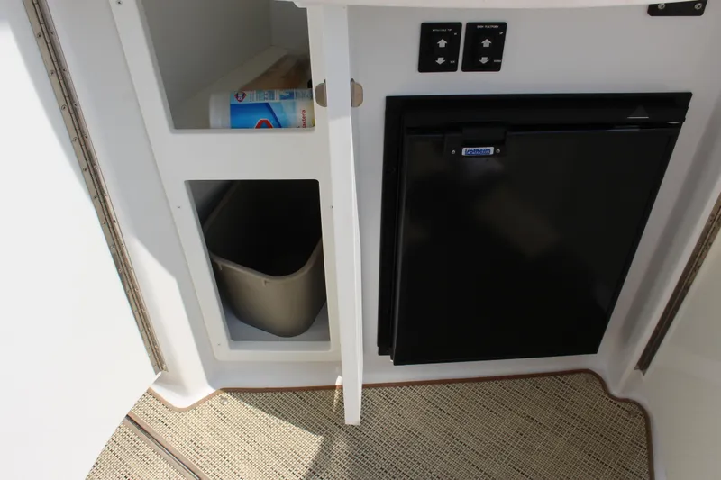 Slide: The Image of Interior of 2017 Cobalt R35 with storage cabinet and compact refrigerator. - 60