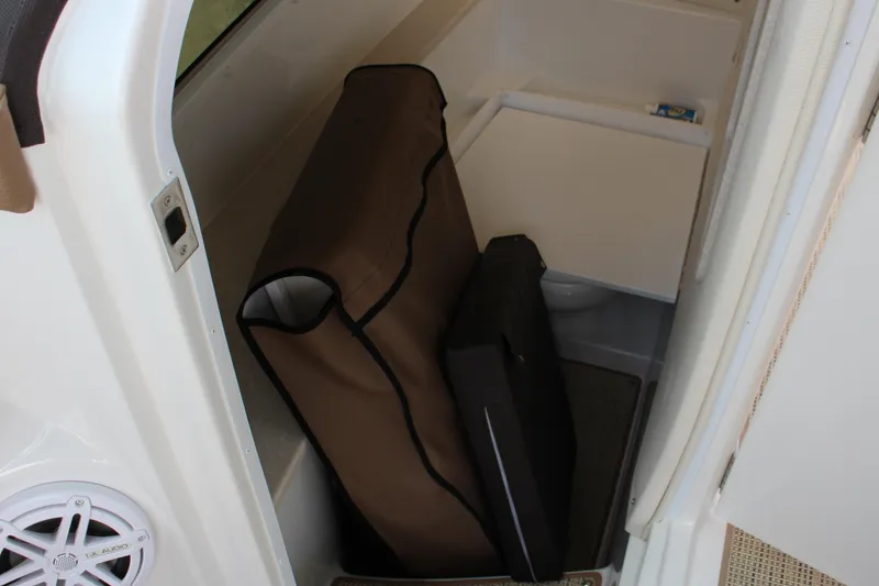 Slide: The Image of 2017 Cobalt R35 interior storage area with speaker and folded items. - 62