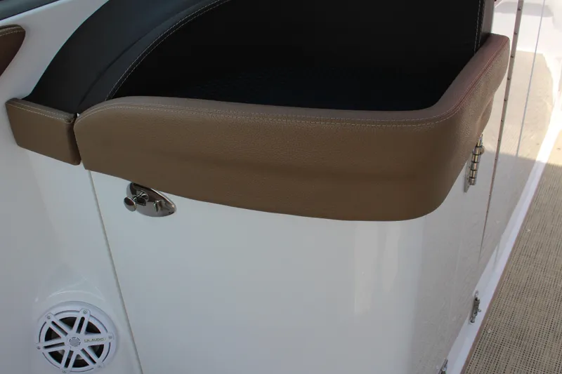 Slide: The Image of 2017 Cobalt R35 boat interior with brown leather trim and speaker detail. - 63