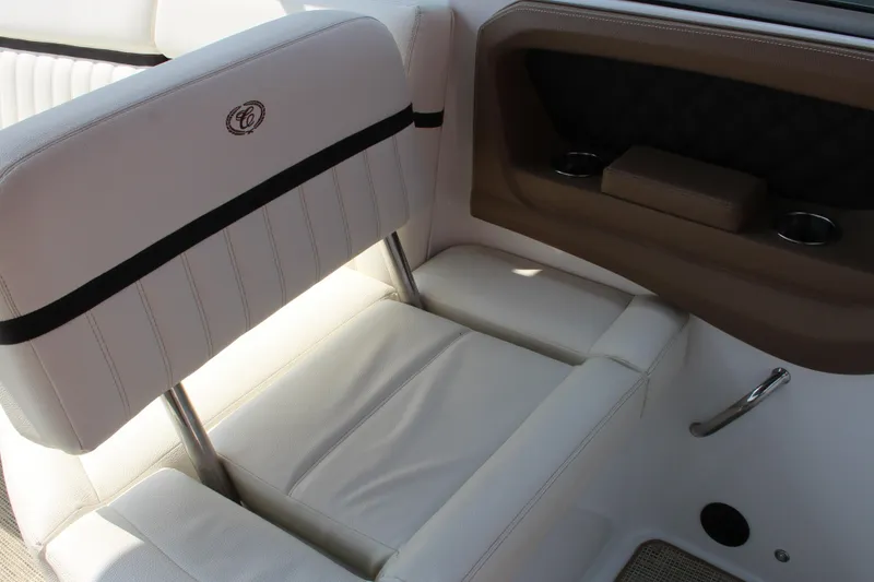 Slide: The Image of 2017 Cobalt R35 Surf boat interior with white leather seating and cup holders. - 7