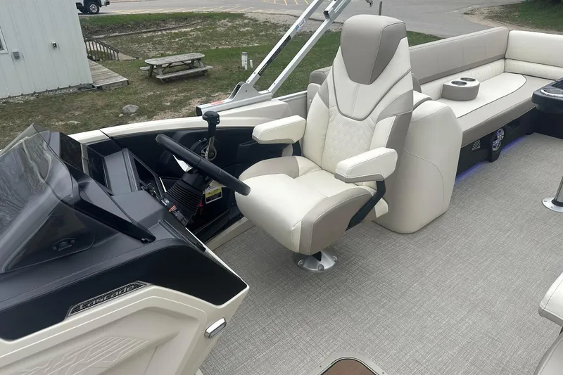Slide: The Image of Luxurious 2025 Tahoe 2585 boat interior with plush seating and modern helm design. - 12