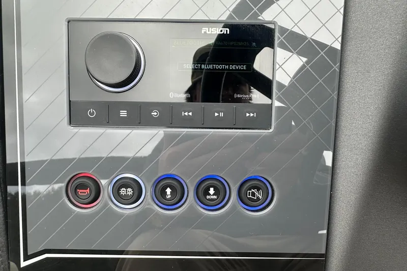 Slide: The Image of Control panel of 2025 Tahoe 2585 with Bluetooth and audio settings. - 14