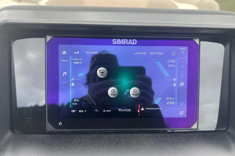 Slide: The Image of Simrad display in 2025 Tahoe 2585 showing engine and battery status. - 15