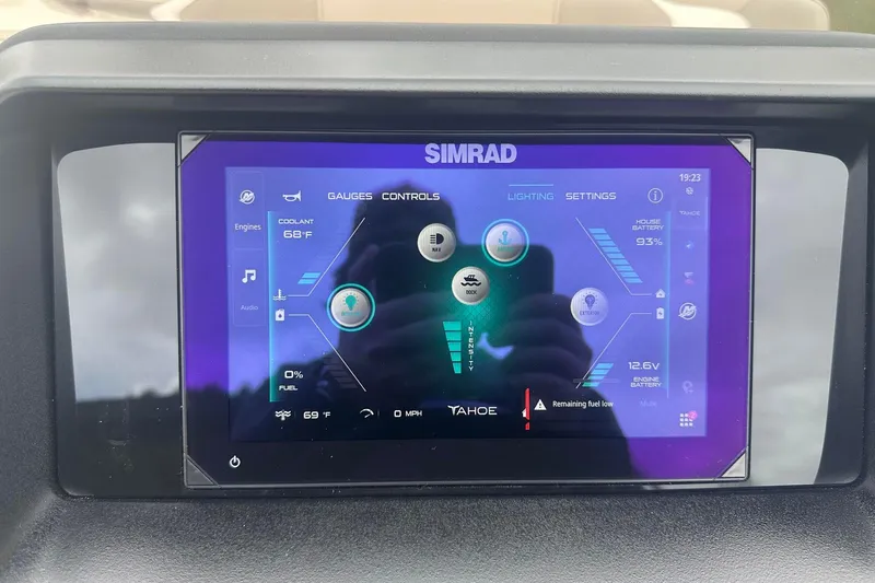 Slide: The Image of Simrad display on 2025 Tahoe 2585 showing gauges, controls, and settings interface. - 16