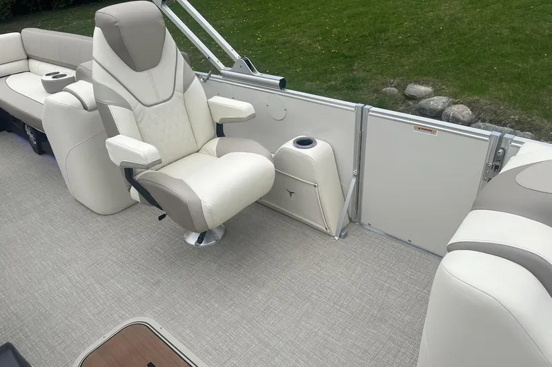 Slide: The Image of Luxurious seating on 2025 Tahoe 2585 pontoon boat with beige upholstery and modern design. - 24