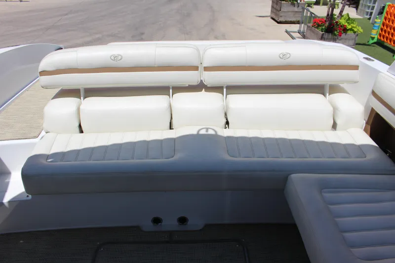 Slide: The Image of 2016 Cobalt R30 boat interior with white cushioned seating and elegant design. - 3