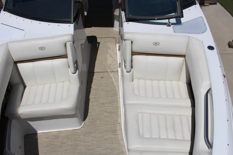 Slide: The Image of 2016 Cobalt R30 boat interior with white leather seating and beige flooring. - 8