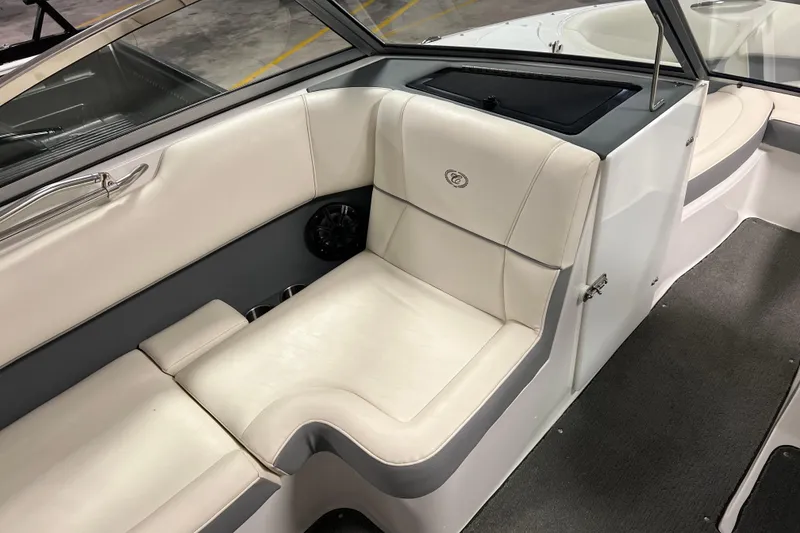 Slide: The Image of Interior of a 2015 Cobalt 200 boat with white seating and gray accents. - 4