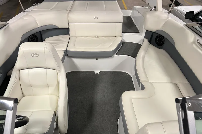Slide: The Image of Interior of a 2015 Cobalt 200 boat with white leather seating. - 6
