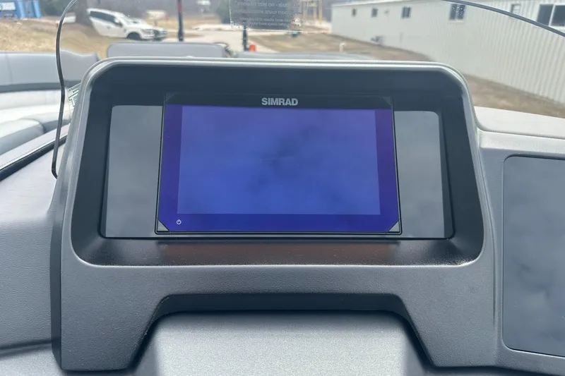 Slide: The Image of Simrad display on 2025 Tahoe 2585 dashboard, showcasing modern navigation technology. - 12