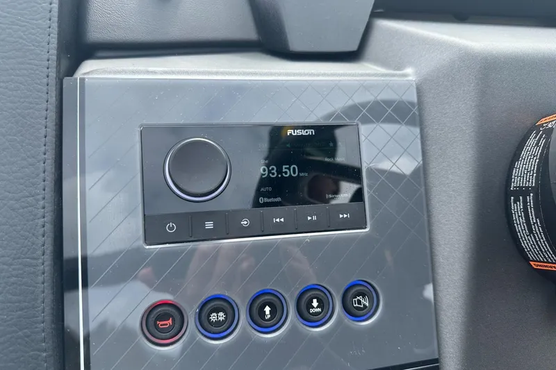 Slide: The Image of 2025 Tahoe 2585 dashboard with Fusion audio system and control buttons. - 13