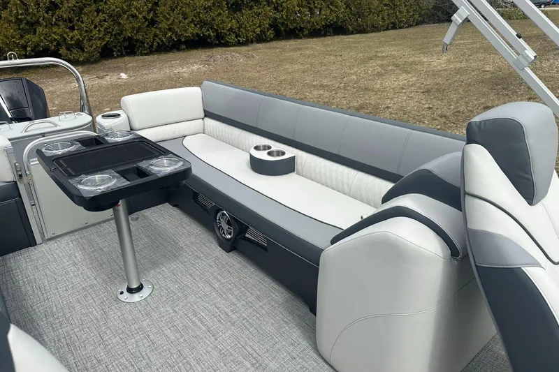 Slide: The Image of Luxurious interior of 2025 Tahoe 2585 boat with plush seating and table. - 15