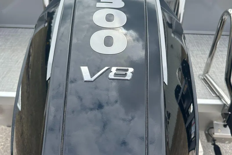 Slide: The Image of 2025 Tahoe 2585 V8 engine cover, sleek black design with chrome lettering. - 4