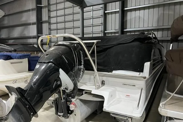 Slide: The Image of 2015 Marker One boat with outboard motor in storage facility. - 4