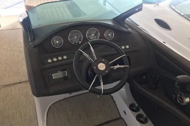 Slide: The Image of Steering console of a 2015 Marker One boat with gauges and controls. - 5