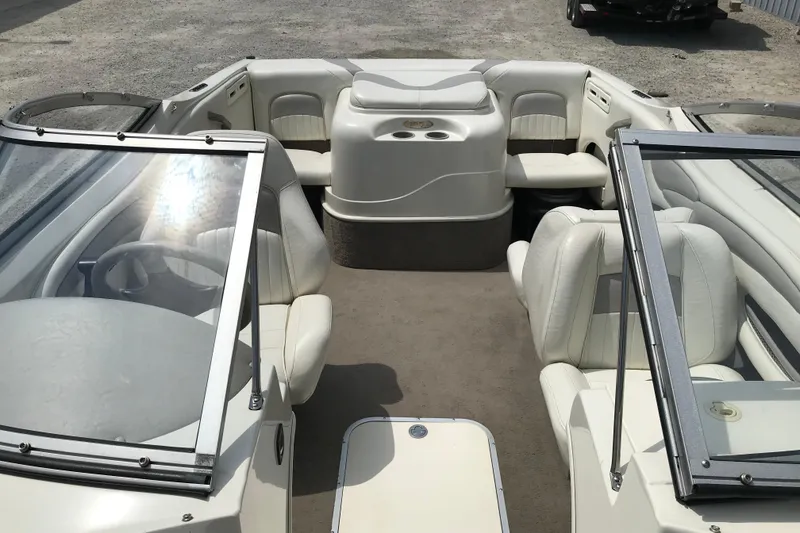 Slide: The Image of 2005 Stingray 195 LR boat interior with white seating and open cockpit design. - 15