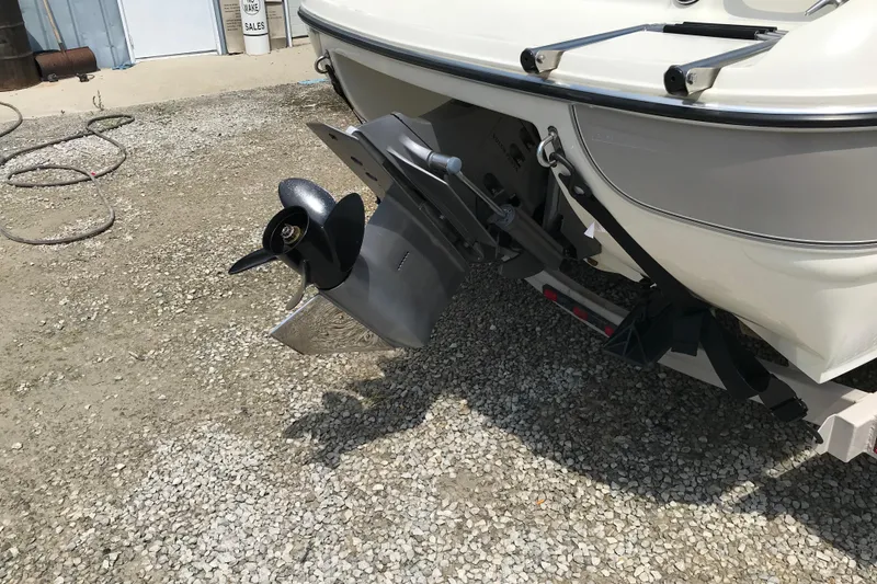 Slide: The Image of Rear view of a 2005 Stingray 195 LR boat with visible propeller and trailer. - 7
