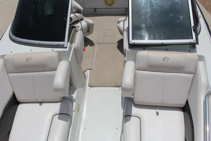Slide: The Image of 2013 Crownline E1 boat interior with white seating and windshield. - 13