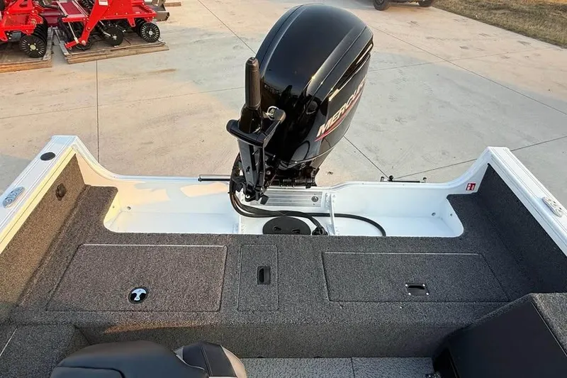 Slide: The Image of 2026 Crestliner 1850 Pro Tiller boat with Mercury outboard motor, rear deck view. - 6