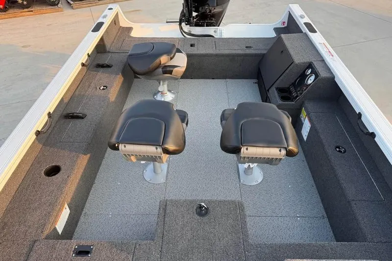 Slide: The Image of 2026 Crestliner 1850 Pro Tiller boat interior with seating and storage compartments. - 7