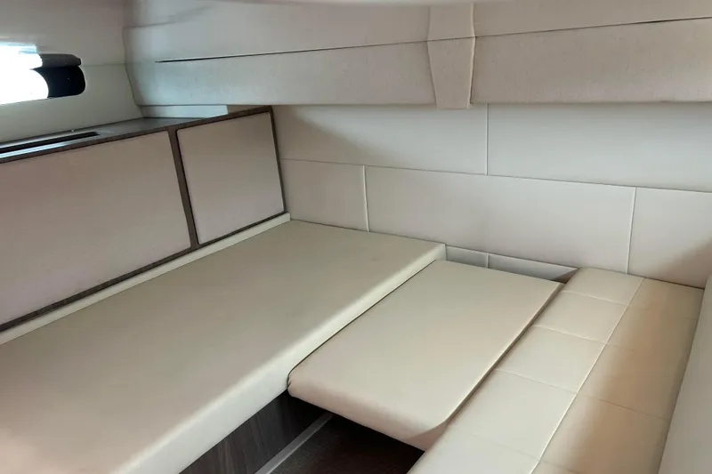 Slide: The Image of 2022 Regal 36 XO interior cabin with beige seating and modern design. - 13