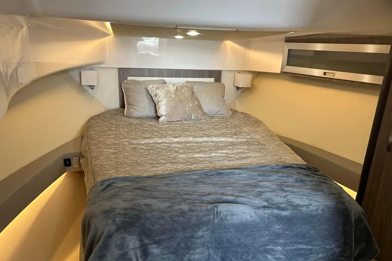 Slide: The Image of Luxurious cabin interior of 2022 Regal 36 XO yacht with cozy bedding. - 17