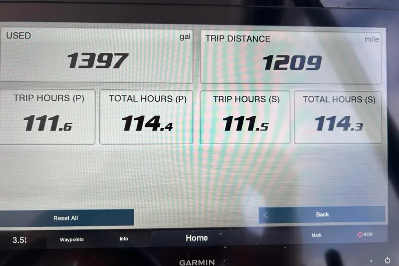 Slide: The Image of Display screen showing fuel usage, trip distance, and hours for 2022 Regal 36 XO boat. - 18