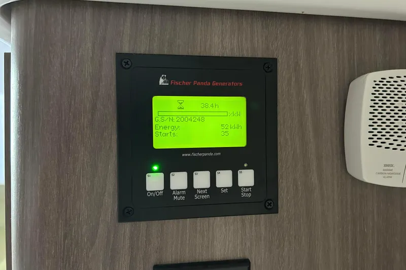 Slide: The Image of Fischer Panda generator control panel on 2022 Regal 36 XO boat, displaying operational data. - 19