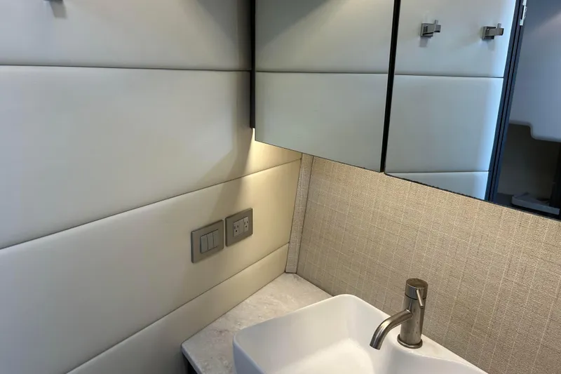 Slide: The Image of Luxurious bathroom interior of 2022 Regal 36 XO yacht with modern sink and fixtures. - 20