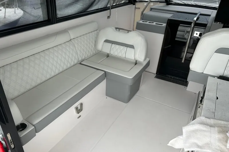 Slide: The Image of Interior of 2022 Regal 36 XO boat with white and gray seating. - 7