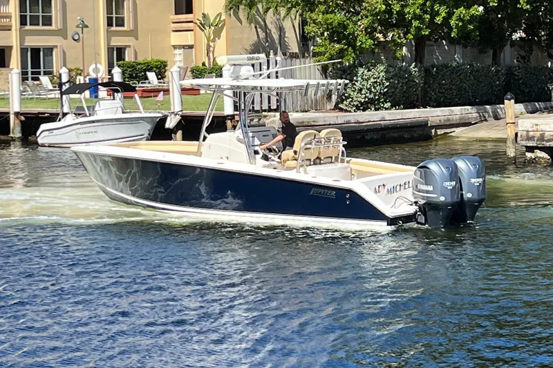 The Image of 2012 Jupiter 29 FS CC boat cruising on a sunny waterfront. - 0