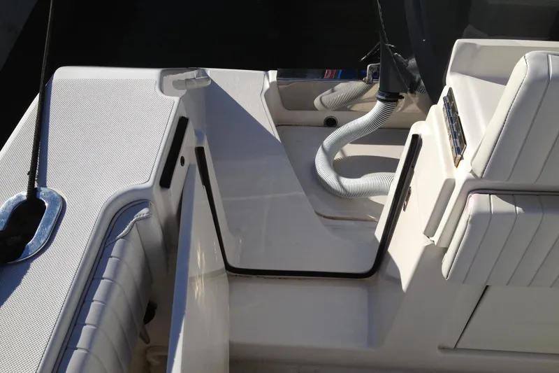 Slide: The Image of 2012 Jupiter 29 FS CC boat interior with seating and storage area. - 14